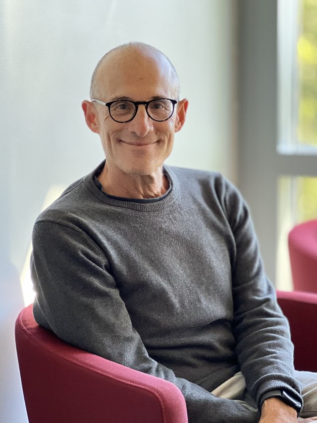 Jonathan Gartner sits in Incubator Lounge facing the camera